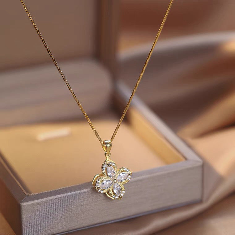 Collana con ciondolo girevole a quadrifoglio con charm in rame placcato oro su catena O in acciaio al titanio per uomo e donna