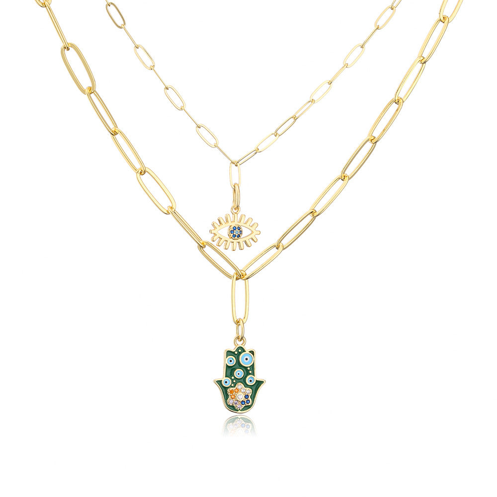 Collana con ciondolo minimalista a mano e occhio per donna in rame con finitura smaltata e intarsi in strass su catena placcata oro 18 carati