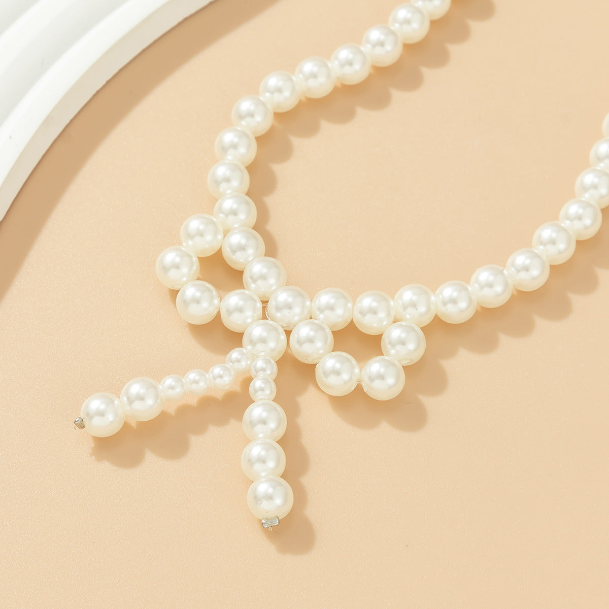 Minimalist Bow-Shaped Choker Necklace with Resin Beads and Round Ball Chain for Women