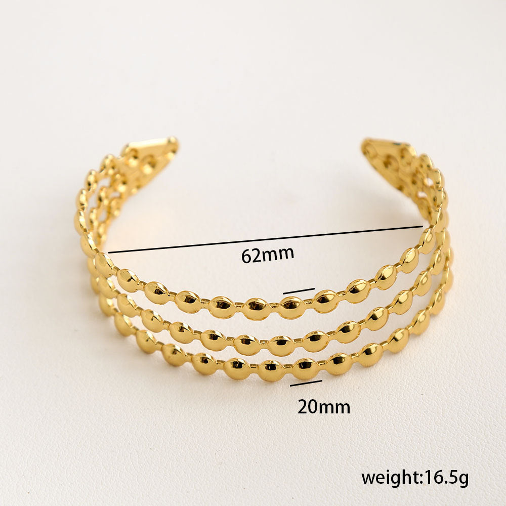 Bracciale Minimalista Ispirato alla Francia in Acciaio Inossidabile con Trafori a Motivi Floreali di Foglie e Girasoli