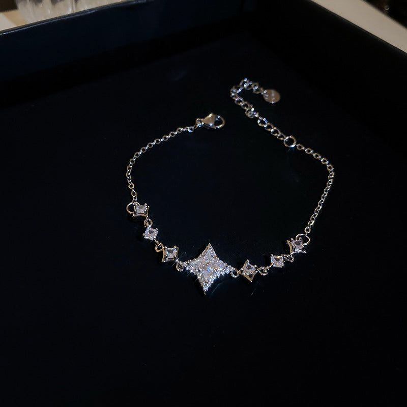 Elegante juego de collar y pulsera de cobre con forma de estrella con incrustaciones de circonita para mujer