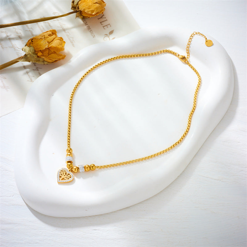 Elegante collar minimalista de acero de titanio con colgante en forma de corazón del Árbol de la Vida, chapado en oro y con cadena de cuentas para mujer