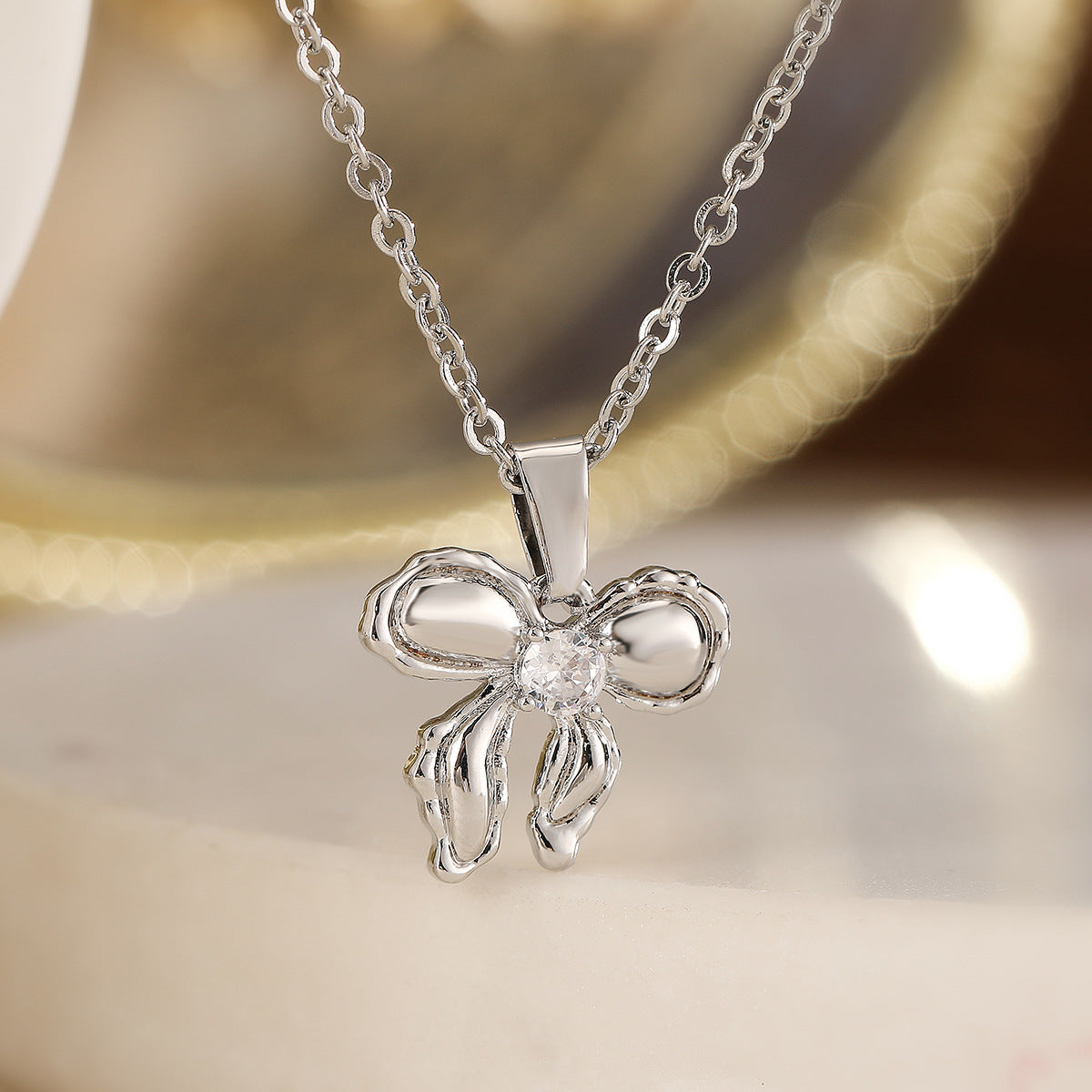 Minimalist Bowknot Pendant Necklace for Women in Copper with 18K Gold Plating and Zircon Accents