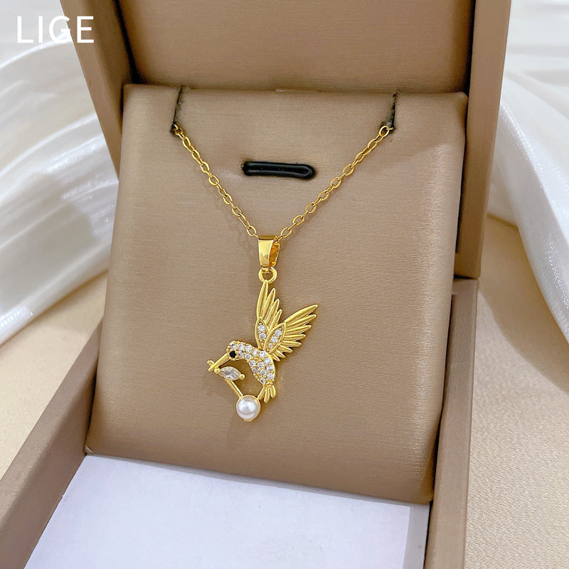 Cartoon Style Swallow-Shaped Pearl Pendant Necklace for Women with Rhinestone Accents on Titanium Steel Chain