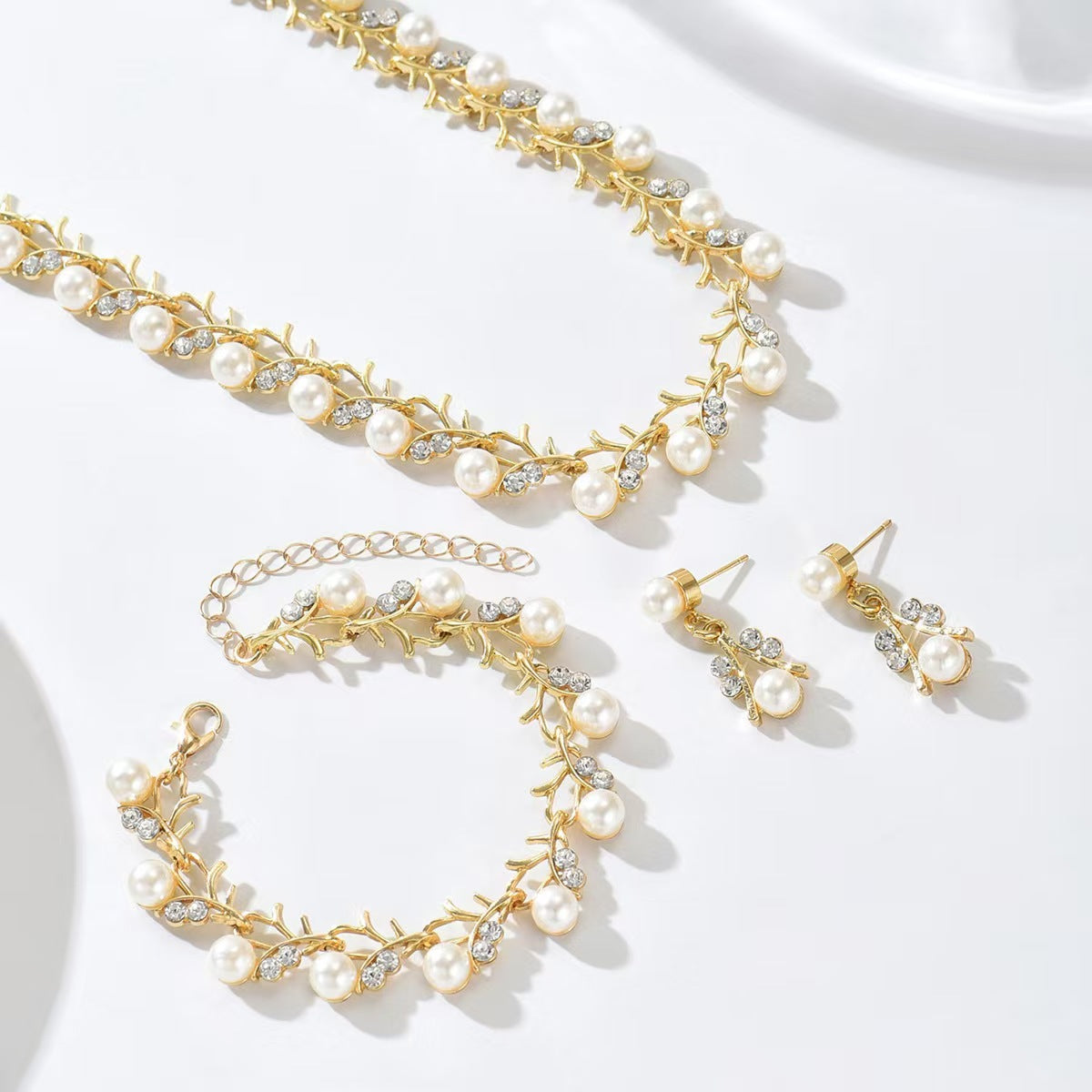 Chanel-Inspired Floral Pearl Necklace Set for Women with Rhinestone Inlay, Wavy Chain, and Matching Earrings and Bracelet