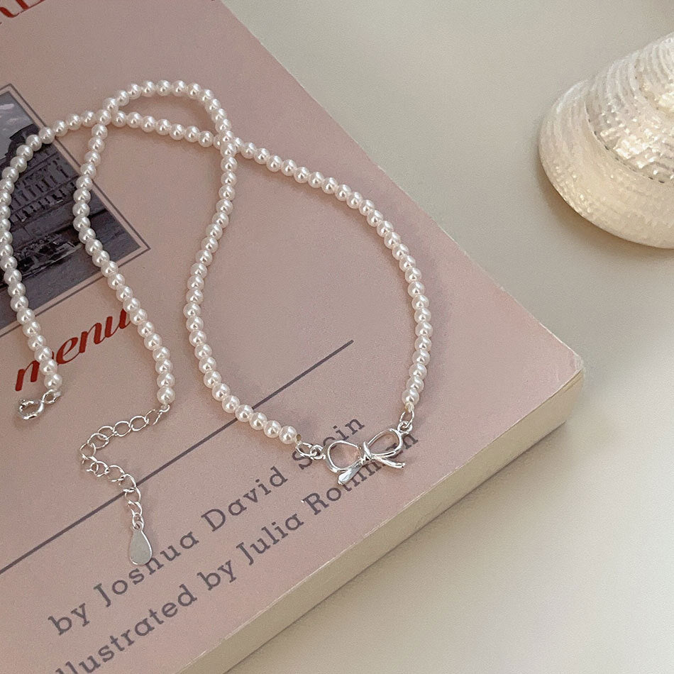 Minimalist Bowknot Pendant Necklace in 925 Sterling Silver with Rhinestone and Pearl Accents on Cross Chain