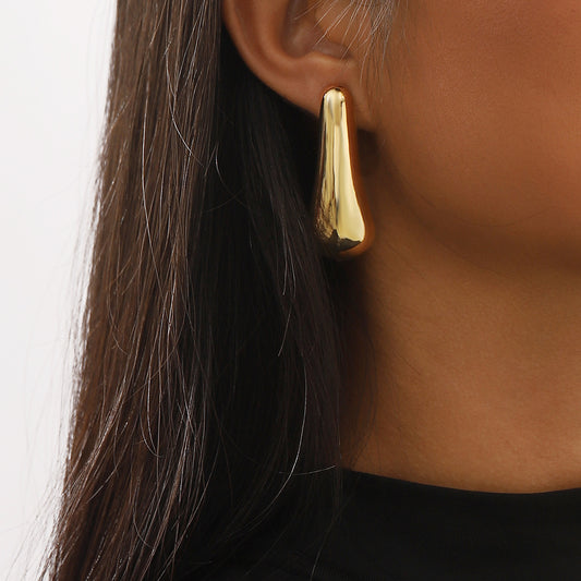Pendientes colgantes geométricos minimalistas de aleación con acabado chapado para mujer, aretes con estilo y diseño de gota