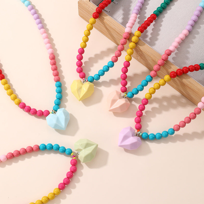 Lindo Collar de Resina con Forma de Lazo para Niñas con Acabado Pintado en Diseño Multicolor, Joyería Infantil Dulce y Juguetona