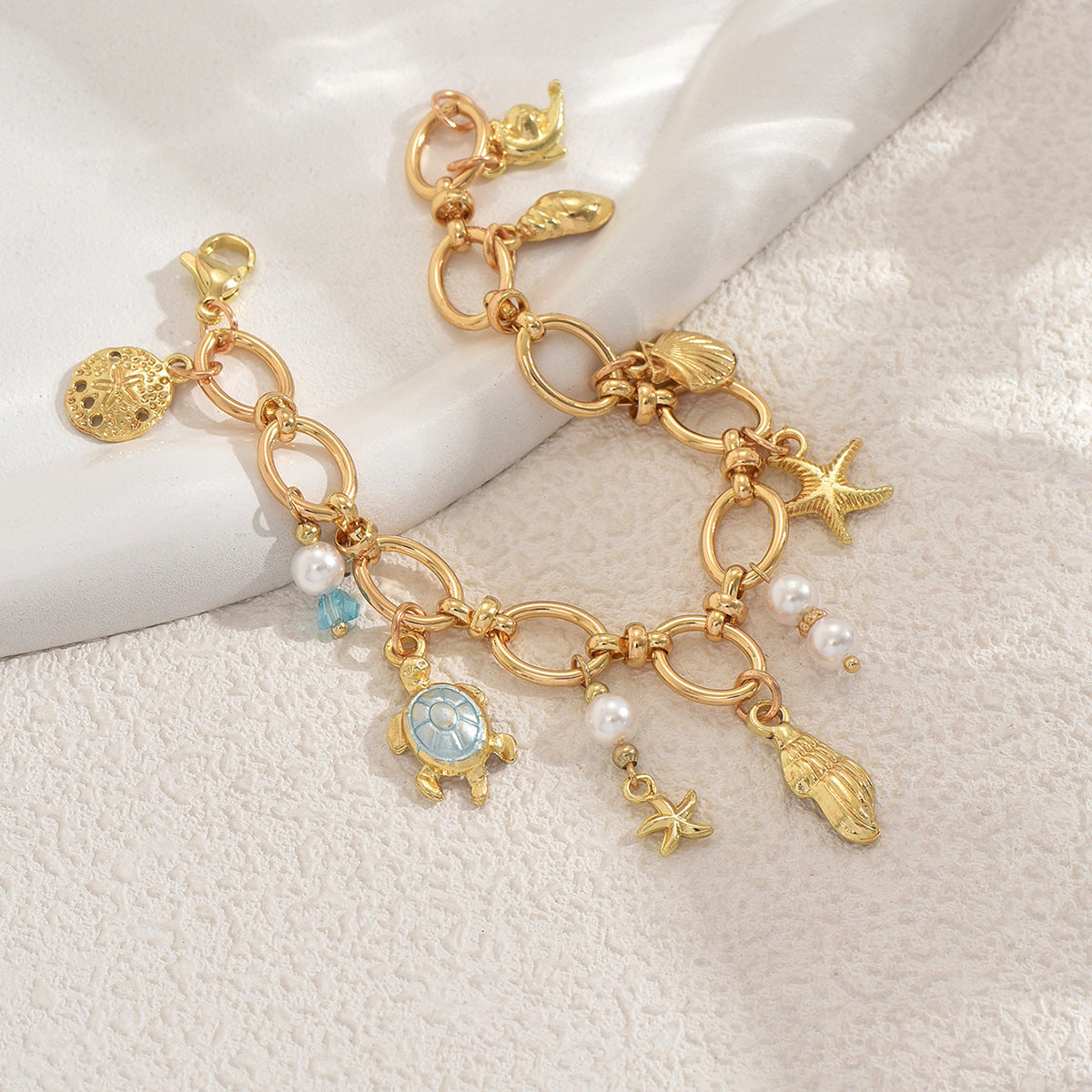 Ocean-Themed Turtle and Seashell Pendant Bracelet for Women with Pearl Inlay and Copper Construction