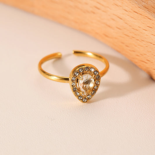 Anillo de acero inoxidable con forma de gota de agua estilo INS con incrustaciones de circonita blanca y acabado chapado al vacío en oro de 18 quilates para mujer