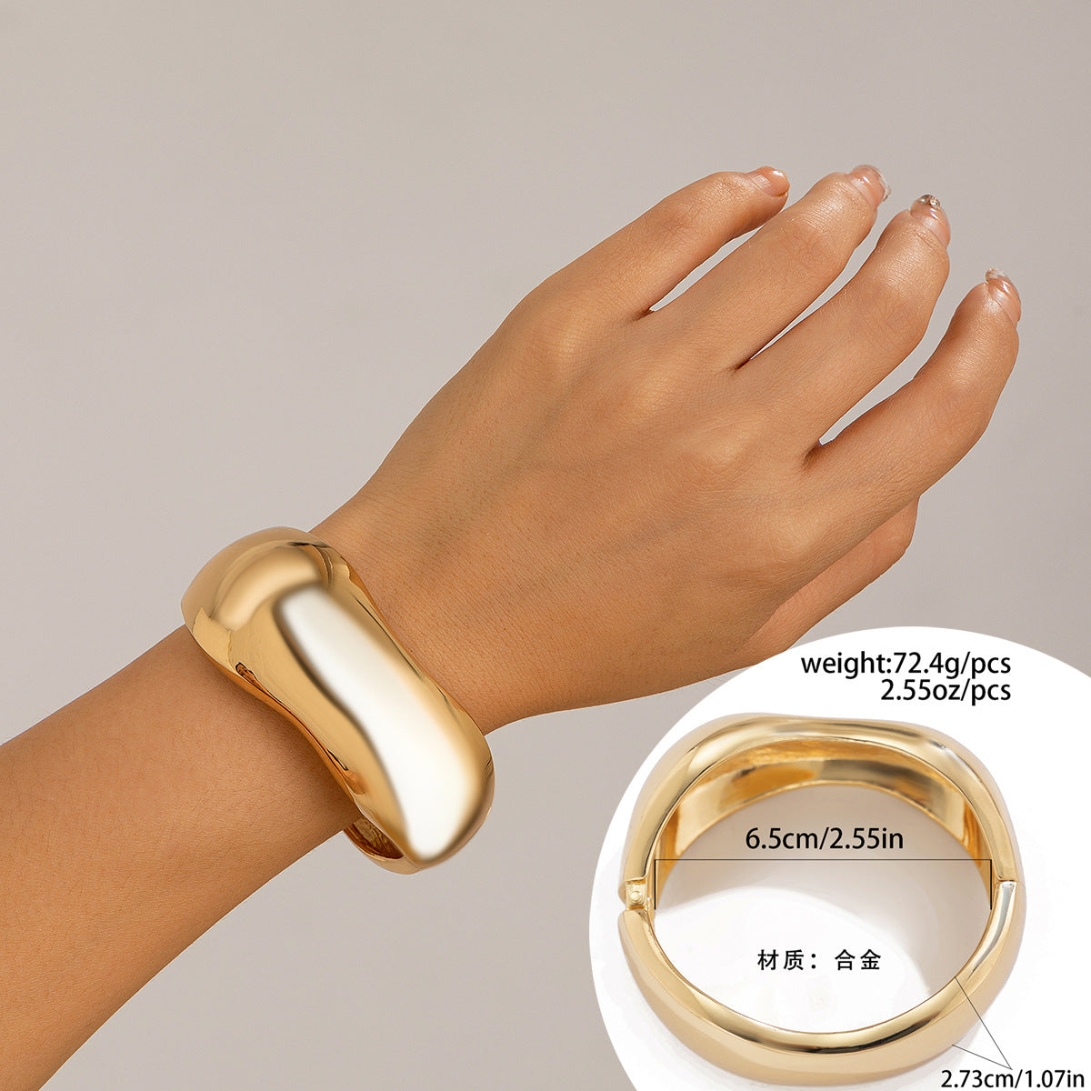 Bracciale a manetta in metallo lucidato a forma di goccia d'acqua oversize con finitura a specchio e design geometrico