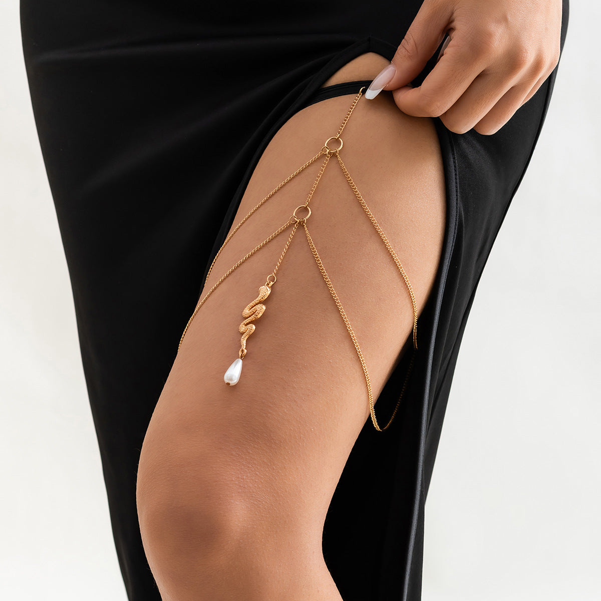 Tobillera de metal minimalista con forma de serpiente, cadena elástica de doble abalorio y detalle de borla para mujer