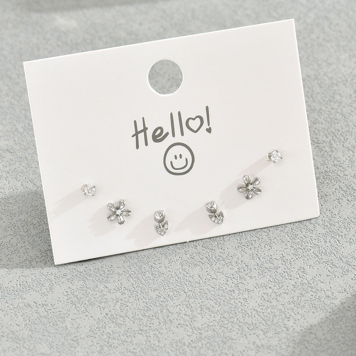 Pendientes de tuerca geométricos florales minimalistas para mujer con incrustaciones de circonita cúbica en base de cobre y postes de acero inoxidable