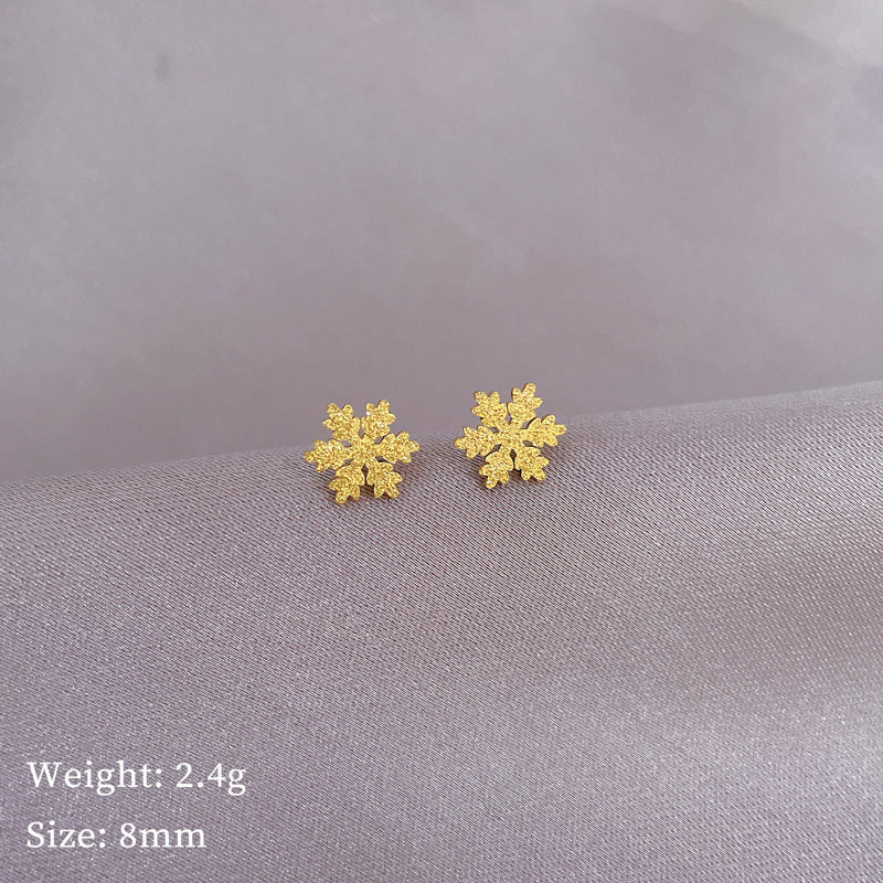 Orecchini a fiocco di neve geometrici minimalisti in titanio e acciaio per donna con finitura in lamina d'oro, ideali per eventi formali e l'uso quotidiano