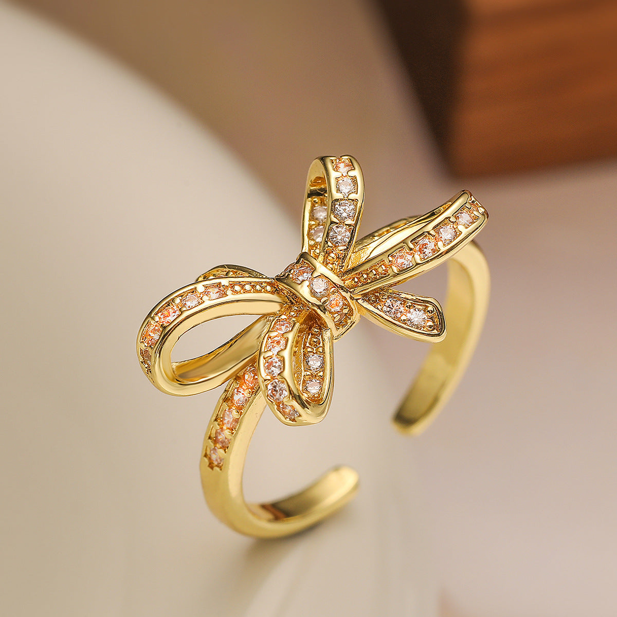 Geometric Bowknot-Shaped Opening Ring for Women in Copper with 18K Gold Plating and Cubic Zirconia Inlay