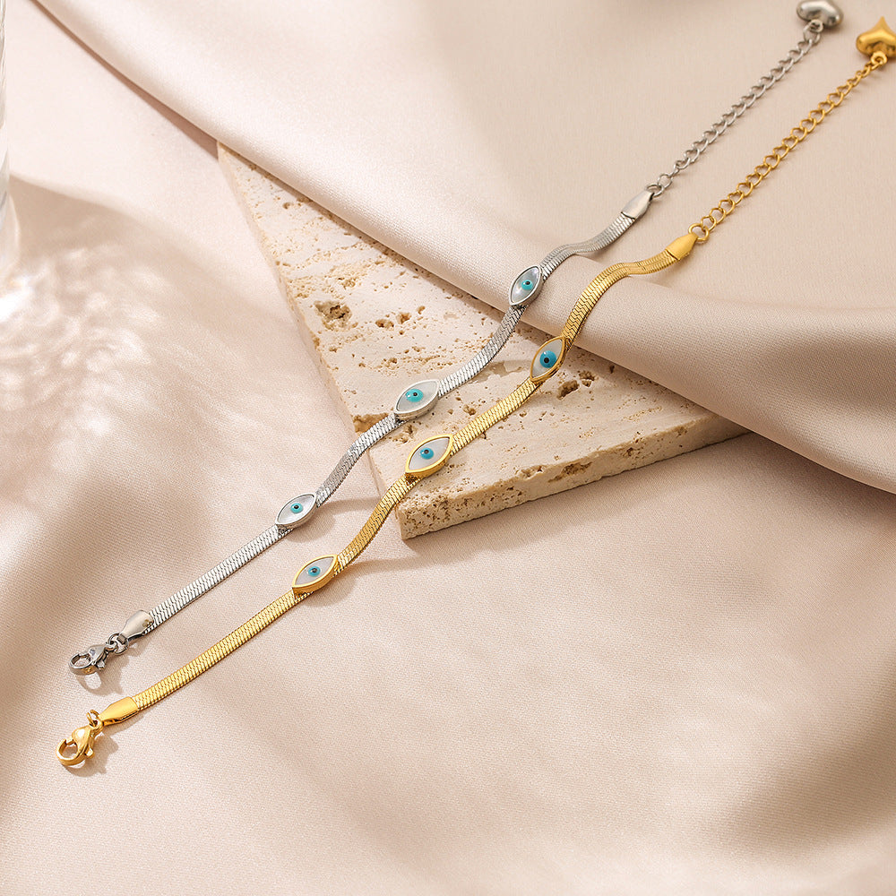 Bracciale minimalista a occhio di Allah in acciaio al titanio con pavé per donna