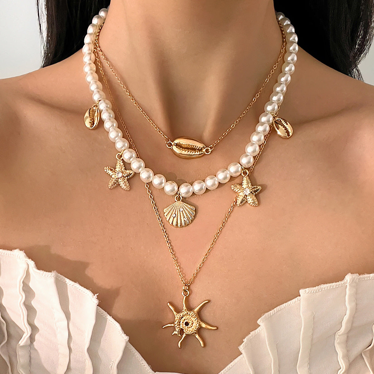 Collana da donna stile Boho da spiaggia con stella, forme geometriche, conchiglie, perle di imitazione, ciondolo in lega placcata e catena di perle
