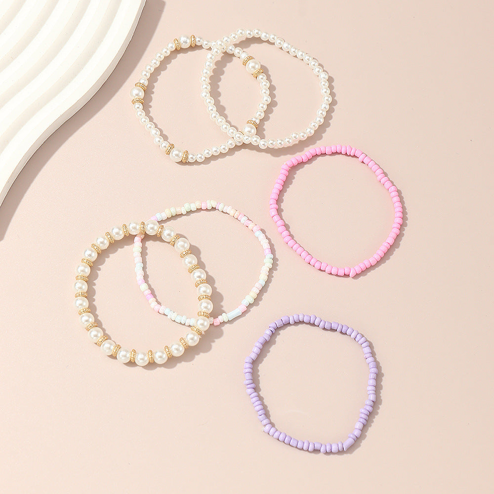 Set de pulseras de cuentas de cristal geométricas minimalistas para niñas en colores pastel rosa y morado