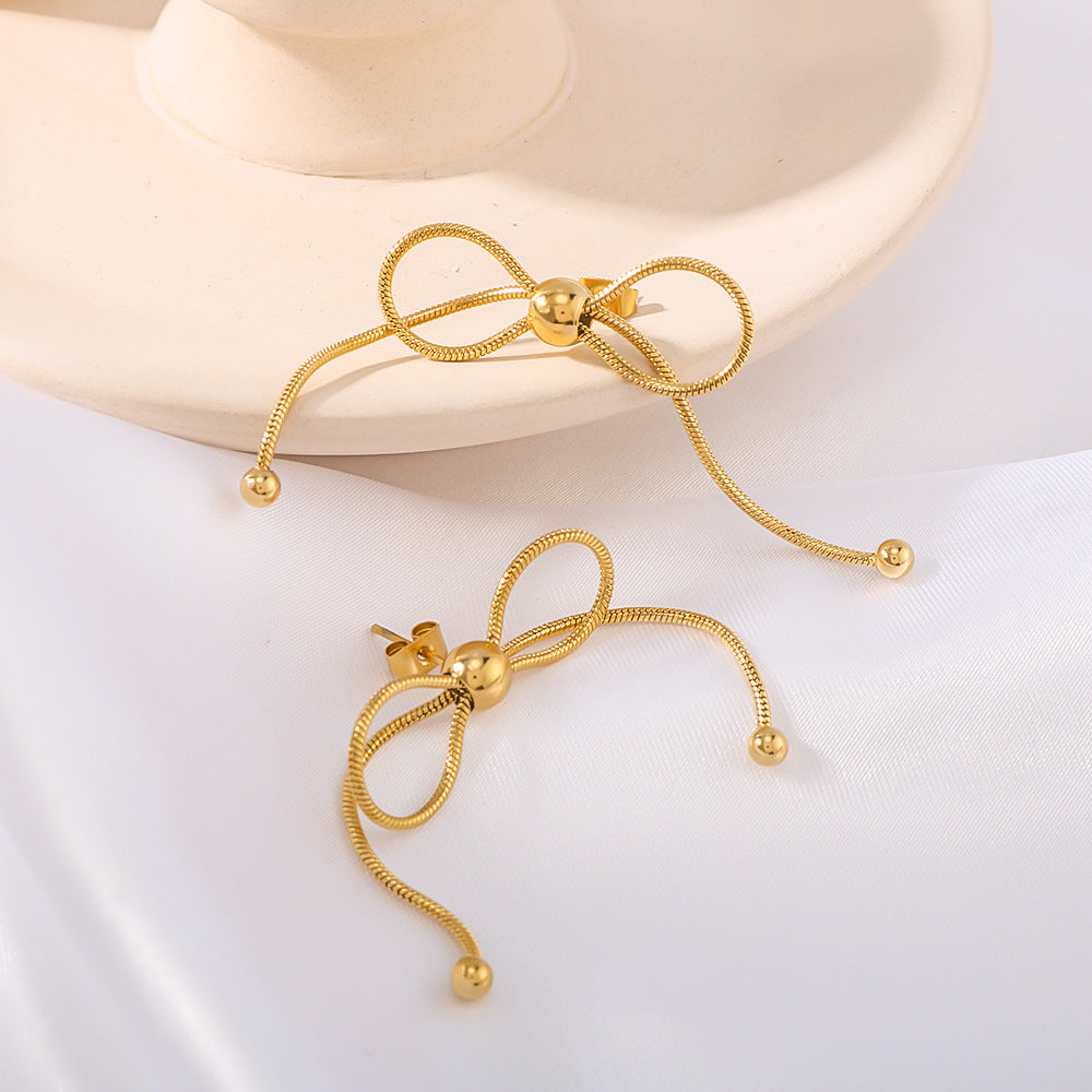 Minimalist Bow-Shaped Stainless Steel Earrings with Pull-Through Design and Tassel Details