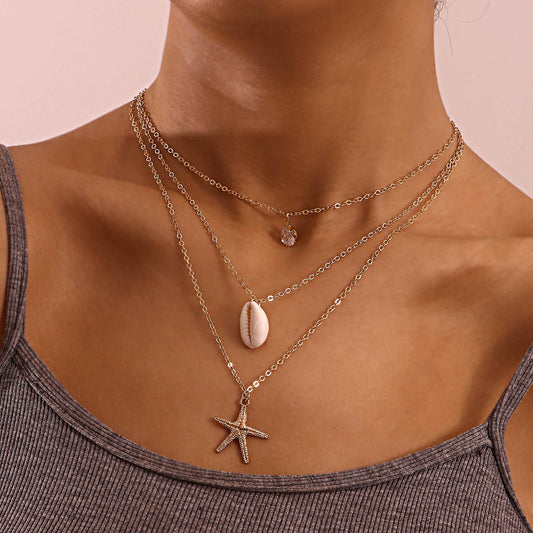 Collar con colgante minimalista de estrella de mar y concha marina para mujer con base de aleación e incrustaciones de pedrería, cadena ajustable de varias capas