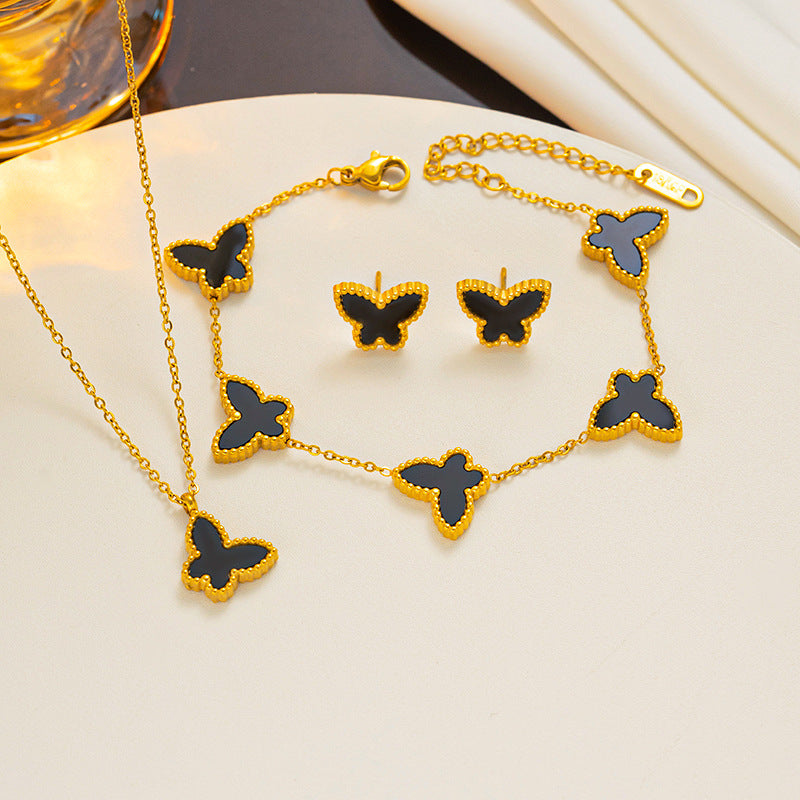 Set di collana, orecchini e bracciale minimalista con farfalla in acciaio al titanio con finitura placcata