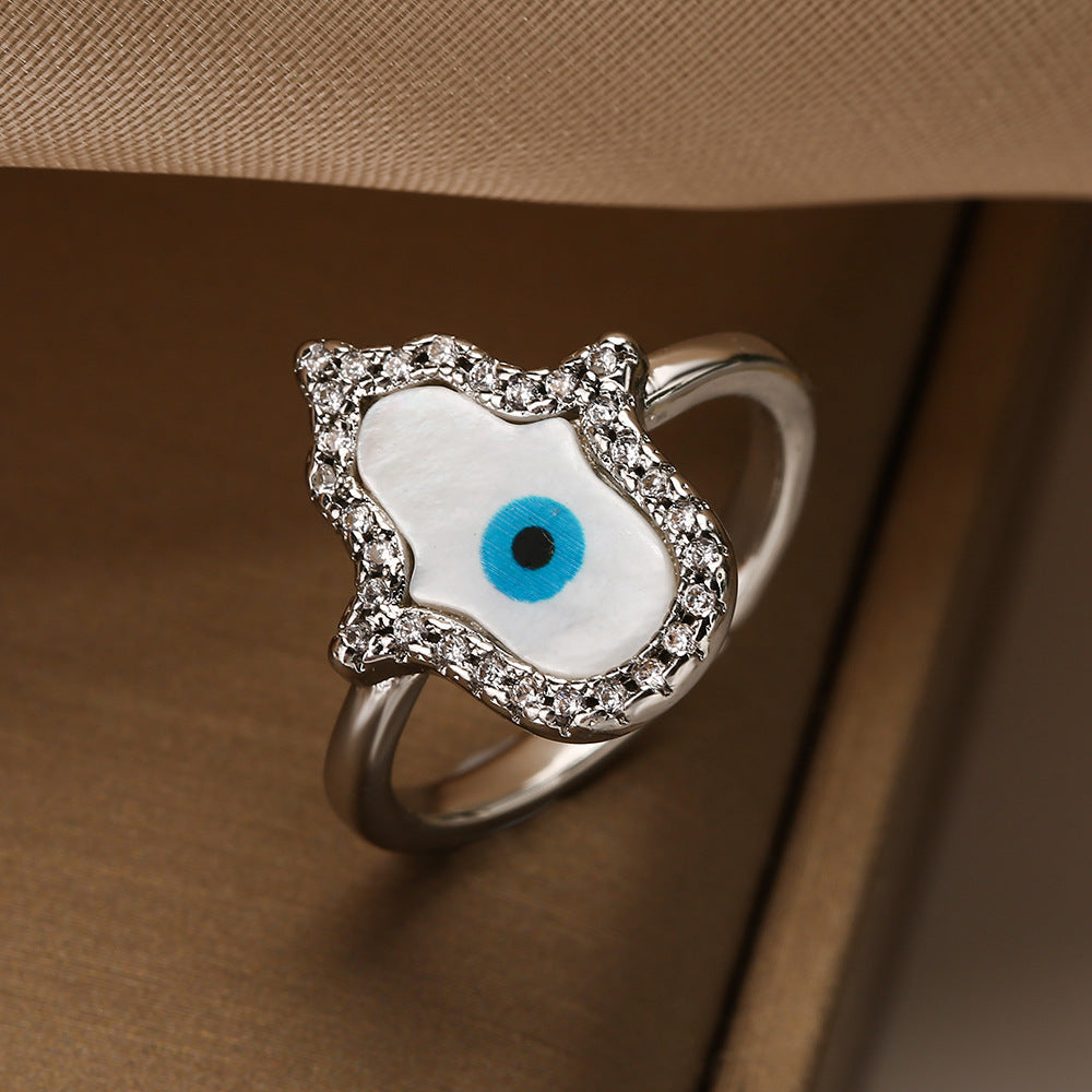 Anello da donna minimalista geometrico in rame placcato oro con micro-pavé di zirconi a forma di occhio turco