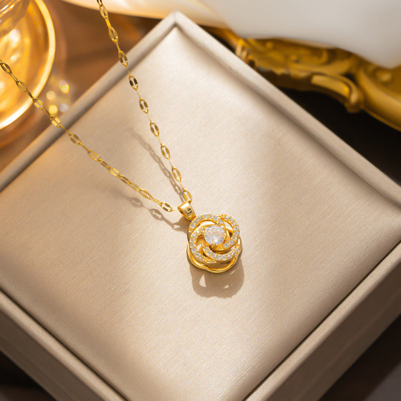 Light Luxury Geometric Camellia Pendant Necklace for Women with Rotating Zirconia Accents in Titanium Steel with Water Wave Chain