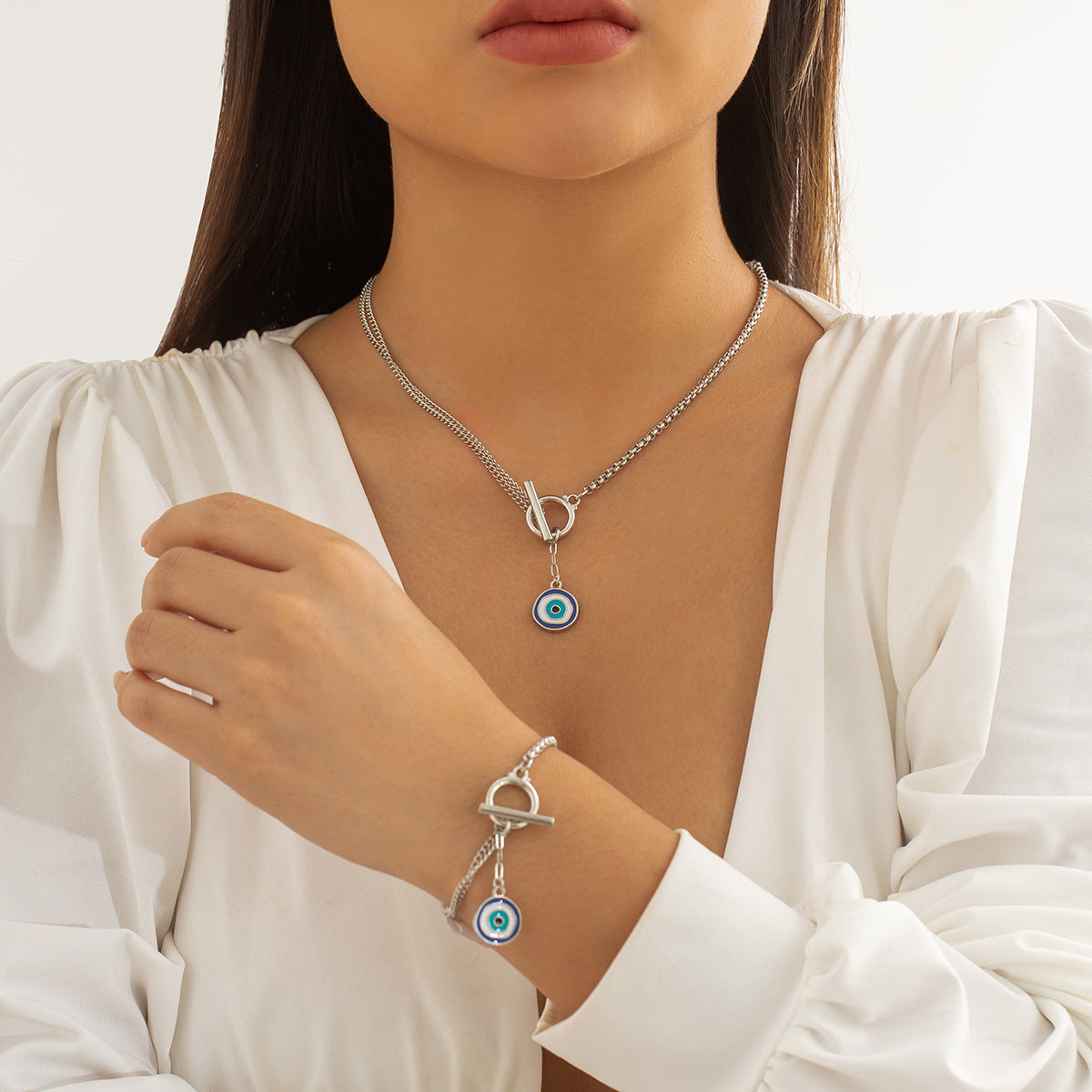 Collana pendente asimmetrica con nappe e ciondolo geometrico a forma di occhio in lega con finitura galvanica da donna