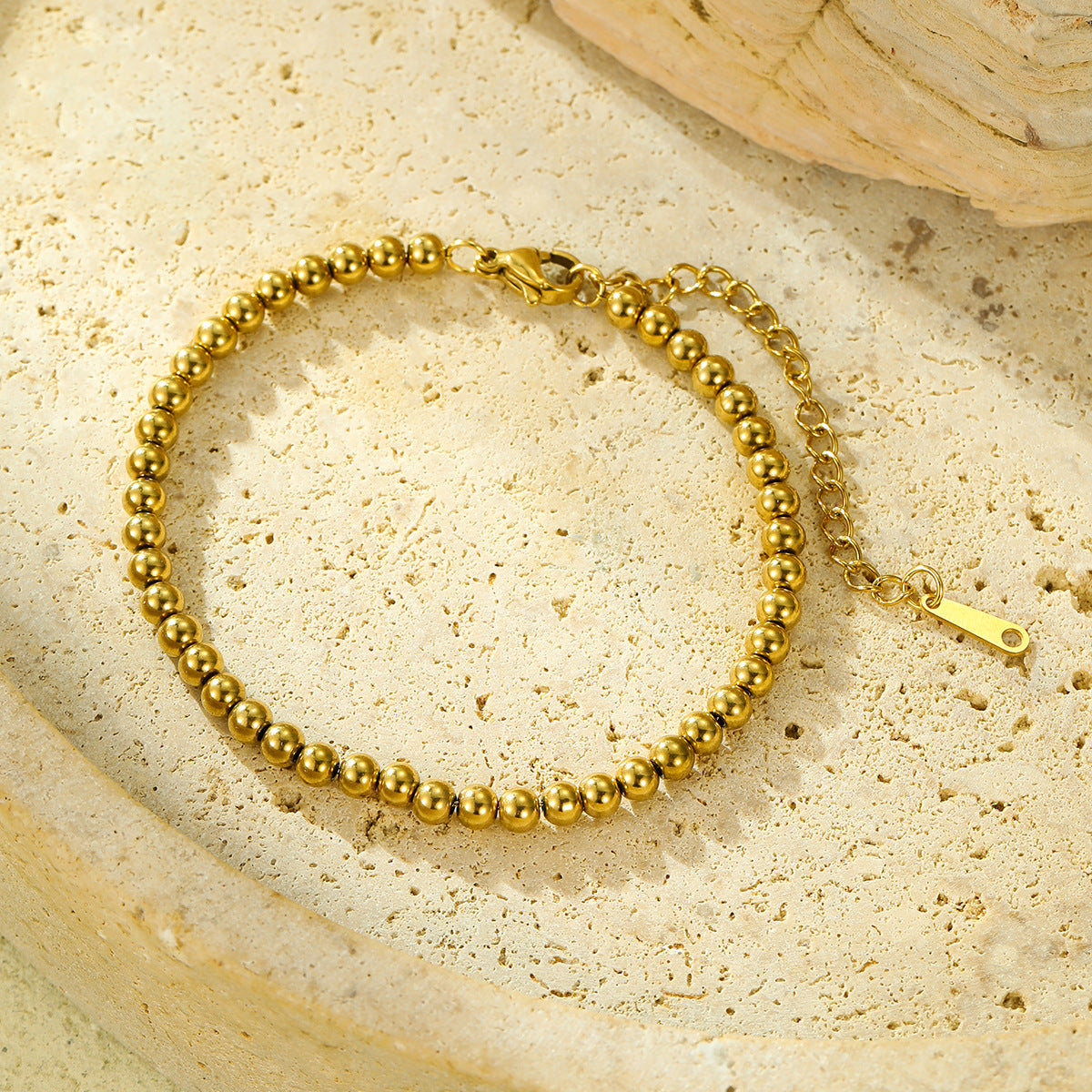 Bracciale minimalista con perline regolabile da donna in acciaio inossidabile placcato oro 18 carati