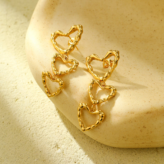 Fashionable Irregular Hollow Heart-Shaped Stainless Steel Earrings with Tassel Detail and Plated Finish