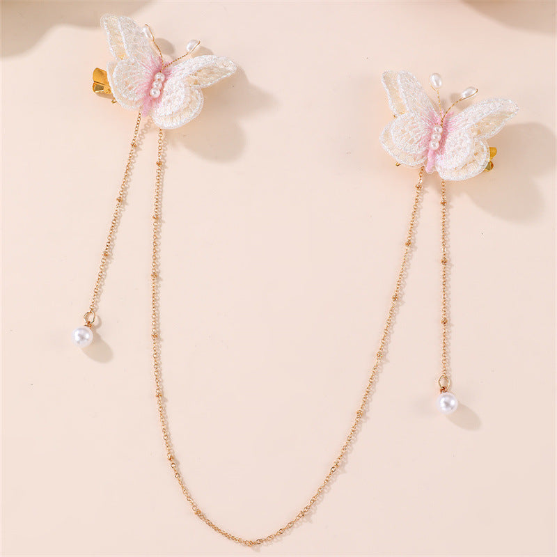 Fermaglio per capelli con fiocco a farfalla in stile naturale per bambini, con materiale in resina e dettaglio catena con nappina
