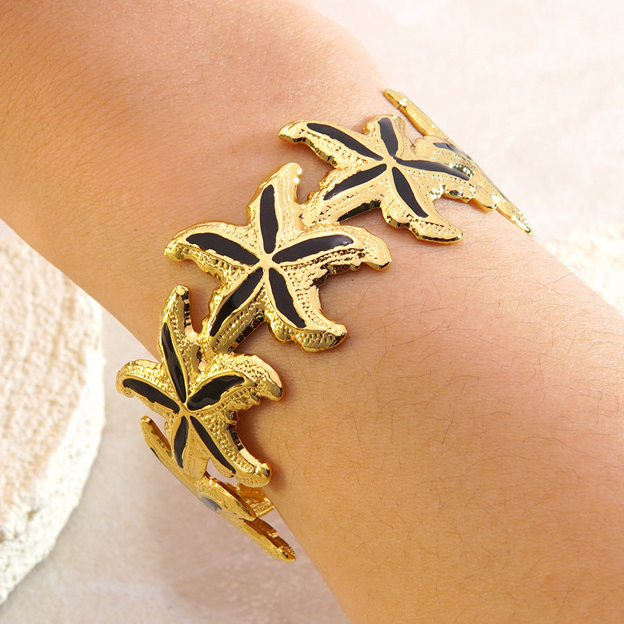 Elegante Bracciale a Polsino in Acciaio Inossidabile con Stella Marina e Goccia d'Olio