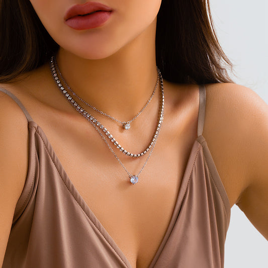 Collana a goccia d'acqua multistrato geometrica minimalista da donna con intarsi in strass e catena incrociata