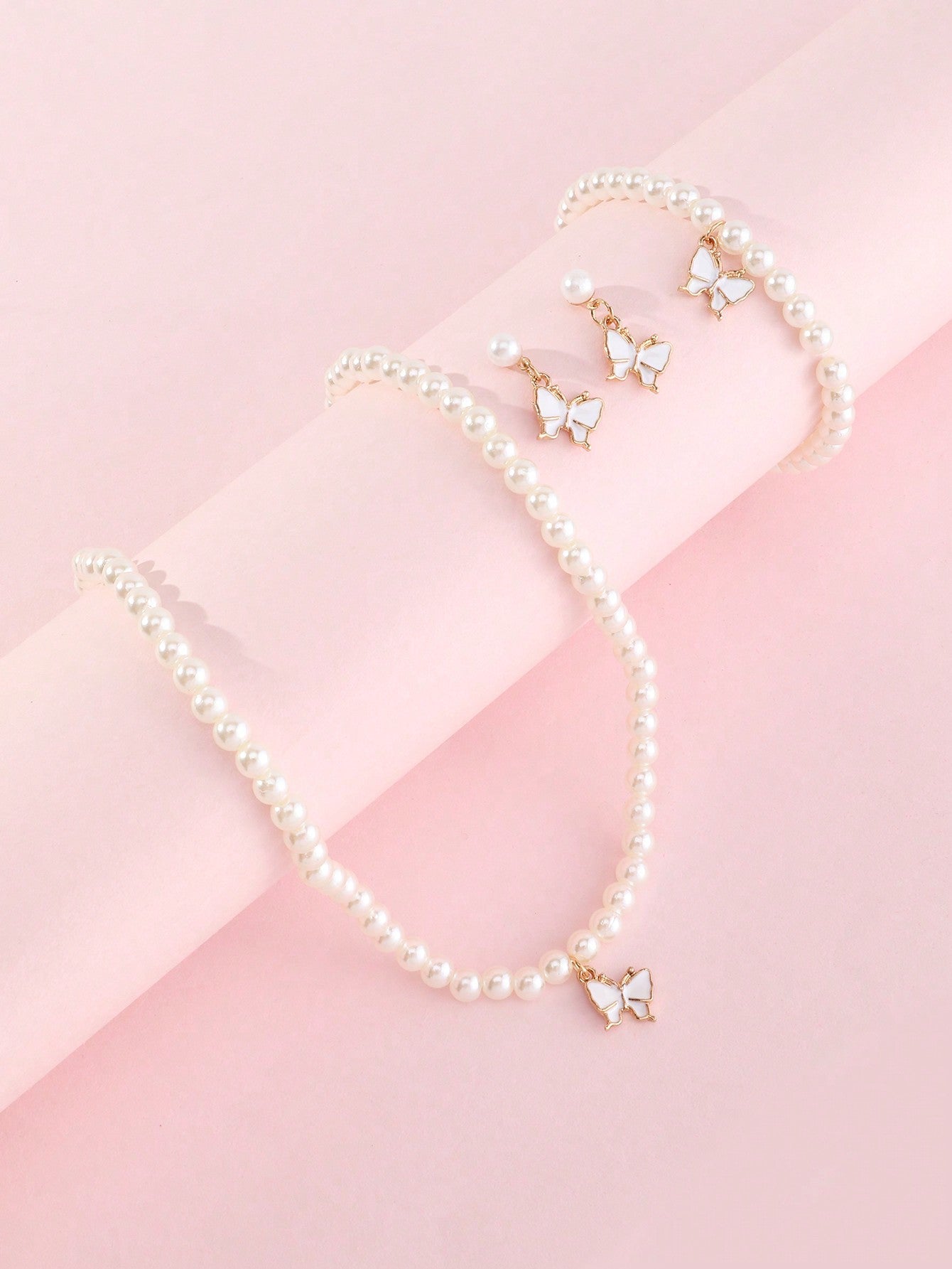 Conjunto Minimalista de Collar con Forma de Lazo de Aleación para Niñas con Detalles de Perlas, Incluye Pulsera, Anillo y Pendientes de Botón
