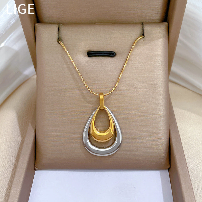 Collana con ciondolo geometrico a goccia minimalista in acciaio al titanio, catena a doppio strato, design floreale botanico, gioielli unisex alla moda per pendolari
