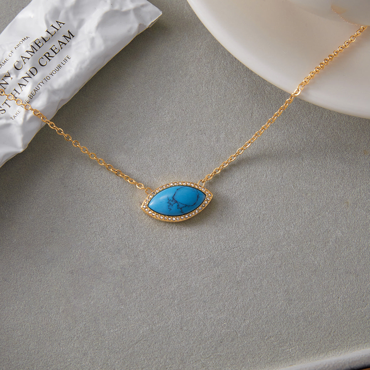 Collana con Ciondolo Occhio di Demone e Orecchini Turchesi in Acciaio al Titanio con Finitura Placcata da Donna