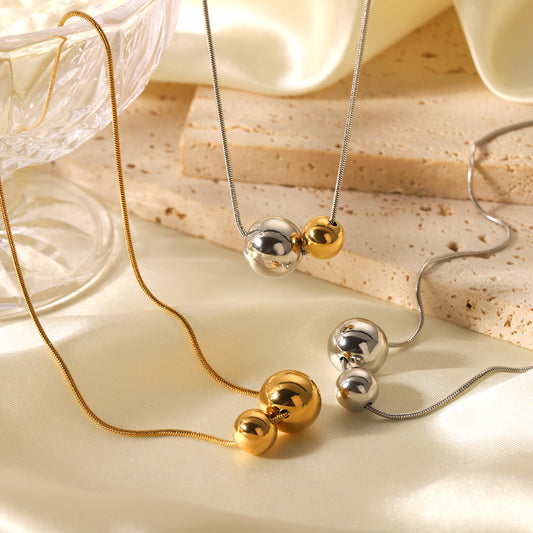 Minimalist Geometric Ball Pendant Necklace in Stainless Steel with Gold and Silver Plated Titanium Steel Accents Snake Chain Collar Jewelry for Women