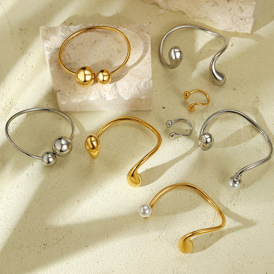 Juego de pulseras de acero de titanio redondo irregular minimalista de moda con acabado galvanizado para mujer