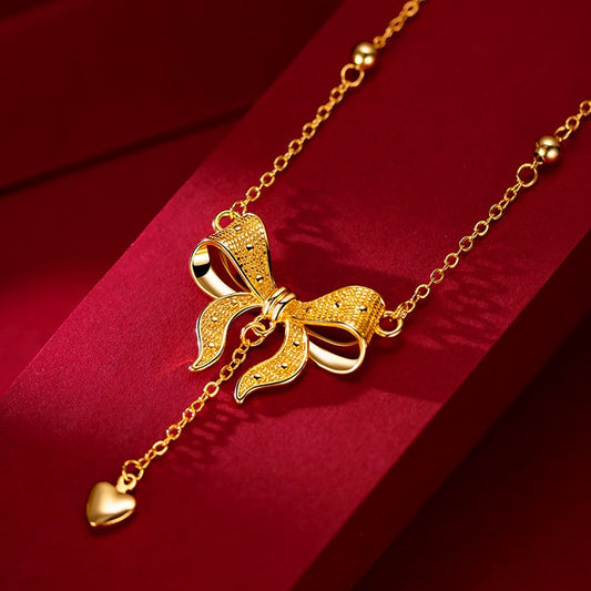 Elegante collar de clavícula de acero de titanio estilo princesa con colgante de corazón, lazos y detalle de flecos en cadena tipo O