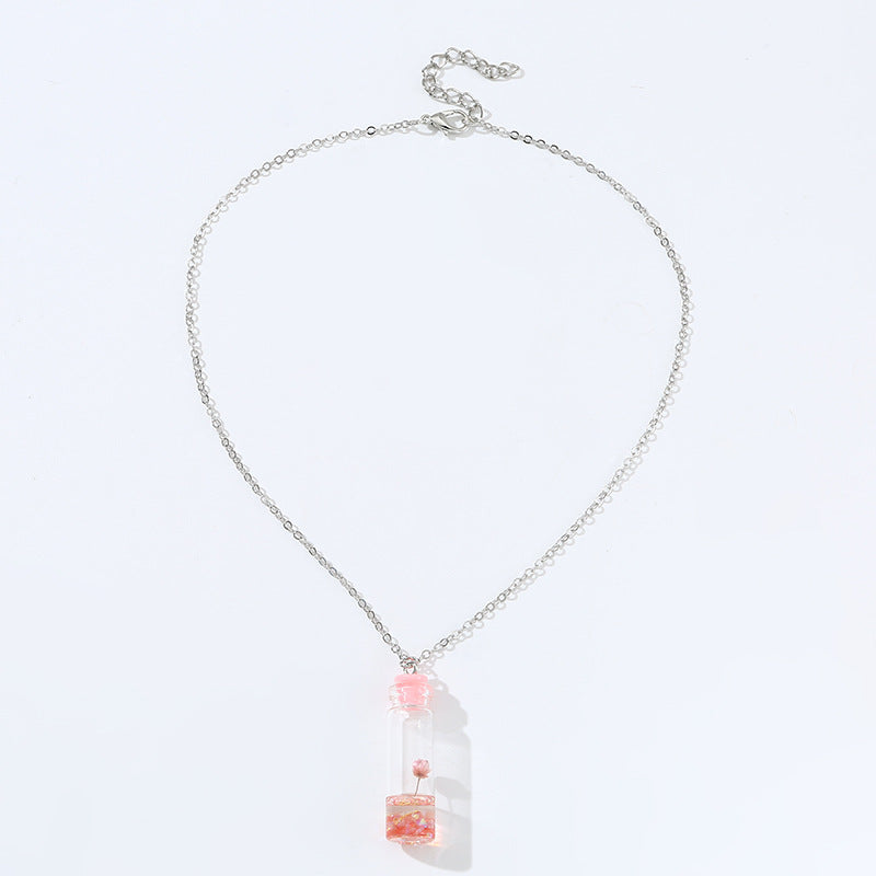 Collar con colgante de cristal geométrico minimalista para niños con flores secas rosas y encapsulación de resina