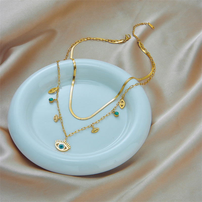Collana con Pendente Occhio Turco Etnico Minimalista Vintage in Acciaio al Titanio con Finitura Placcata e Catena a Serpente