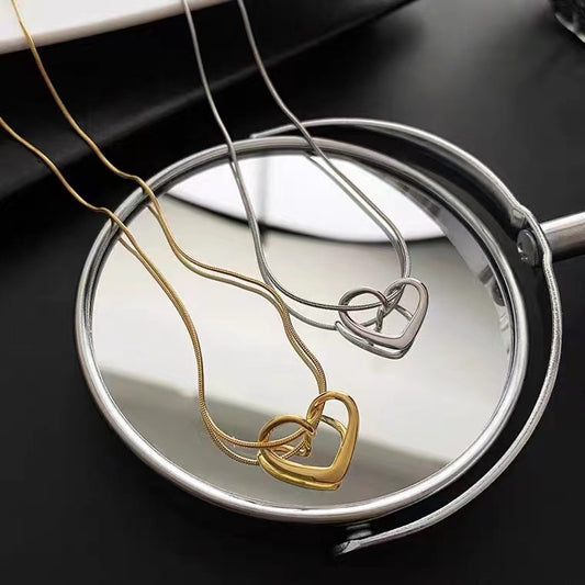 Minimalist French Style Hollow Heart Titanium Steel Clavicle Necklace for Women with Gold Plating and Snake Chain