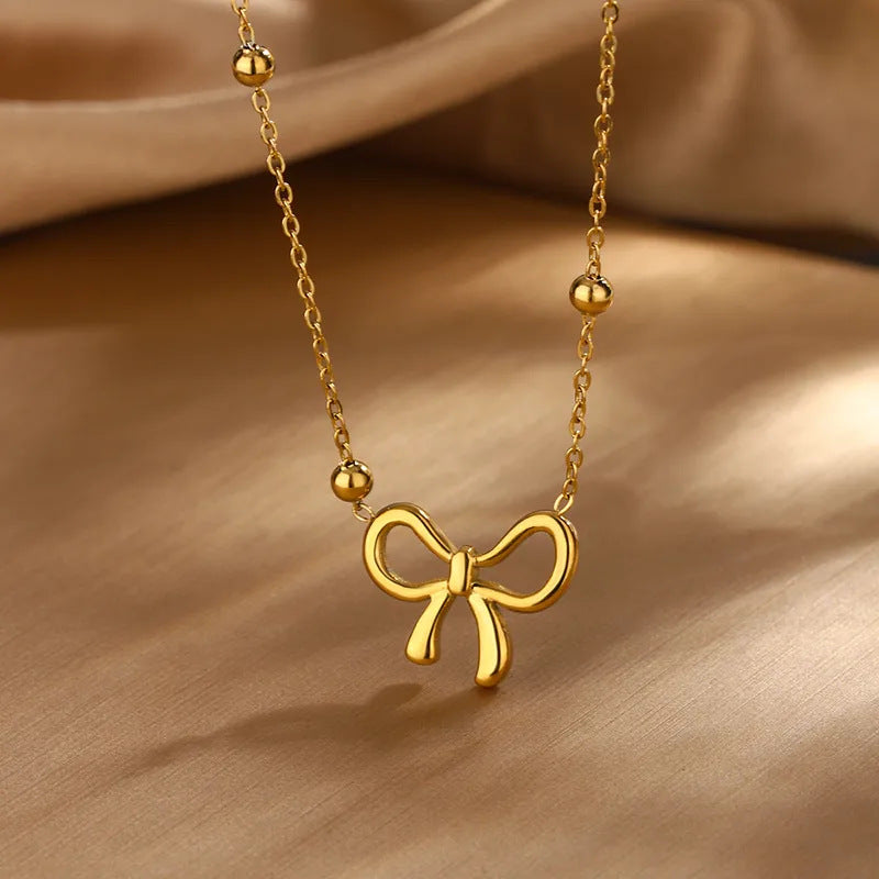 Elegante Parure di Collana e Orecchini con Fiocco in Acciaio Inossidabile Placcato Oro 18K da Donna