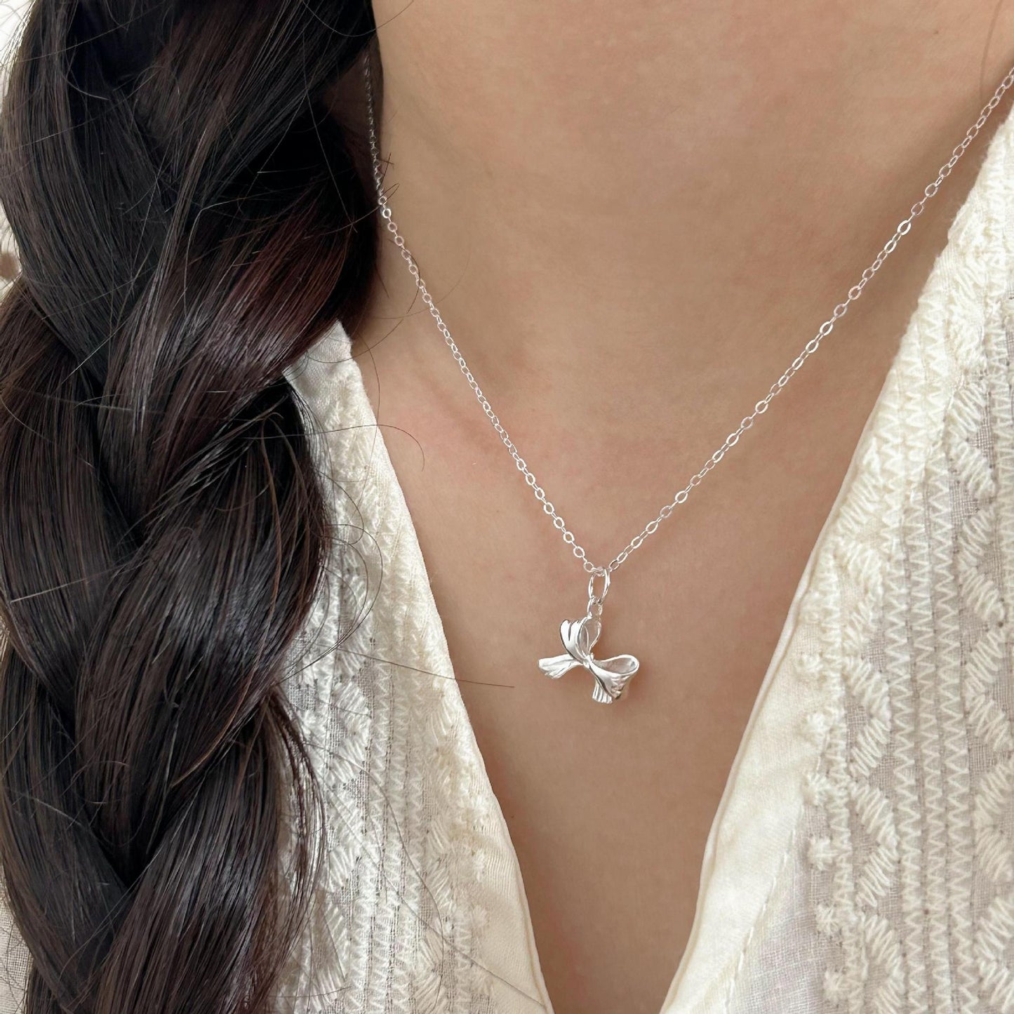 Minimalist Bow Knot Pendant Necklace in 925 Sterling Silver with Plated Finish on Cross Chain