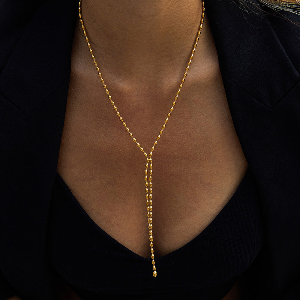 Collana a Y geometrica in acciaio inossidabile con pendente in titanio e finitura placcata per donna