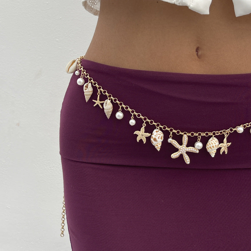 Cinturón de cadena metálica con forma de estrella de mar minimalista para mujer, con detalles de perlas de imitación y cierre de mosquetón