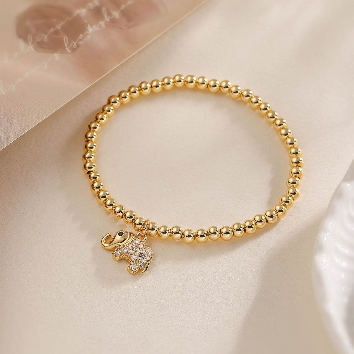 Bracciale con ciondolo a forma di elefante e cavalluccio marino geometrico alla moda con perline in rame, base in rame placcato oro 18 carati, intarsio in zirconi, da donna