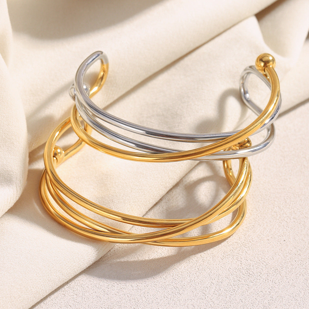 Bracciale da donna in acciaio inossidabile placcato oro 18 carati con design geometrico a linea incrociata, stile minimalista