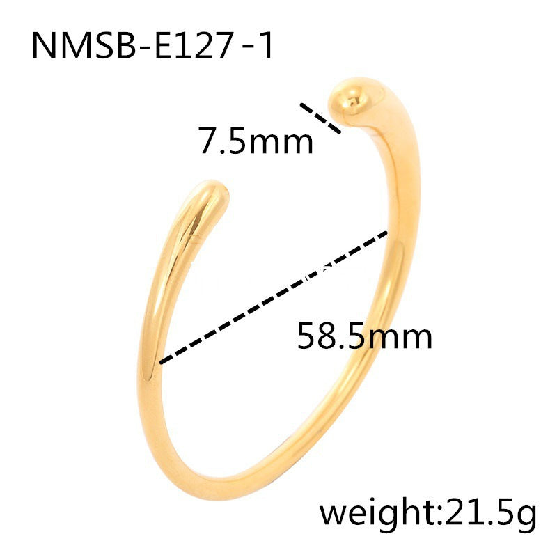 Pulsera de acero titanio de estilo vintage con acabado pulido y patrón circular texturizado para mujer