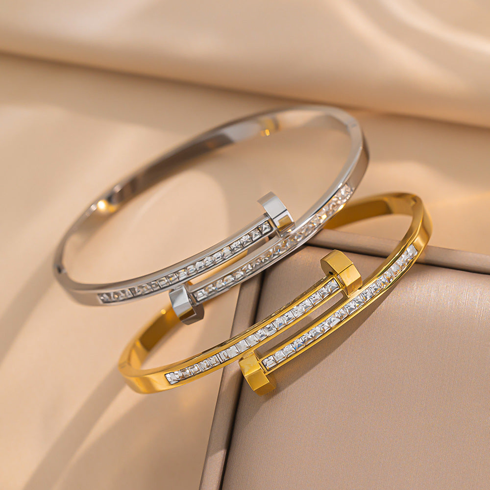 Bracciale minimalista geometrico in acciaio al titanio con zirconi micro-pavé da donna